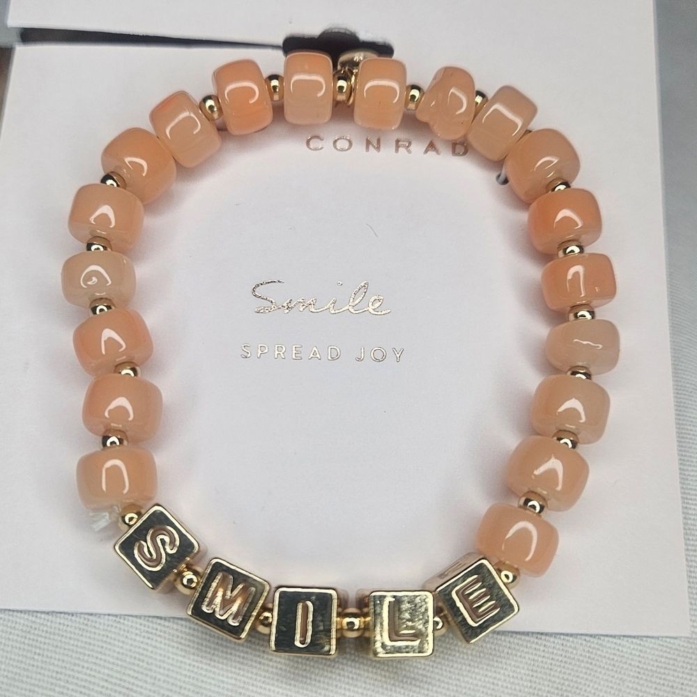 Lauren Conrad Gold Tone Metal And Peach Glass Bead Stretch Smile Bracelet